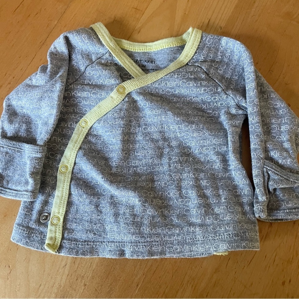 Calvin Klein Gray and Yellow trim baby(new born)Shirt size 0-3 long sleeve